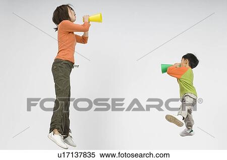 Mother and son shouting with megaphone View Large Photo Image Stock Photography - Mother and son shouting with megaphone. Fotosearch