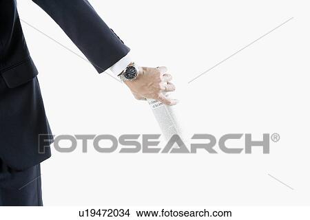 Arm of businessman holding newspaper View Large Photo Image Picture - Arm of businessman holding newspaper. Fotosearch