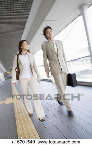 Business people walking, blurred motion View Large Photo Image Stock Photo - Business people walking, blurred motion. Fotosearch
