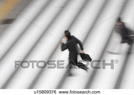 Businessman crossing street View Large Photo Image Stock Photograph - Businessman crossing street. Fotosearch
