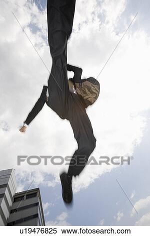 Stock Photography - Businessman jumping. Fotosearch