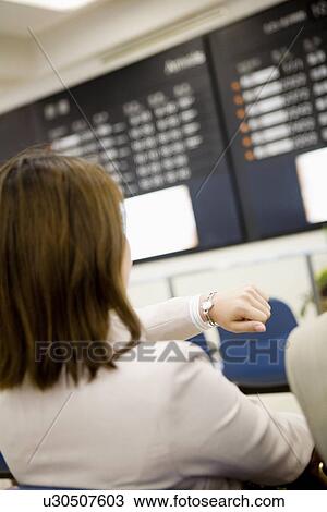 Businesswoman sitting at airport View Large Photo Image Stock Image - Businesswoman sitting at airport. Fotosearch