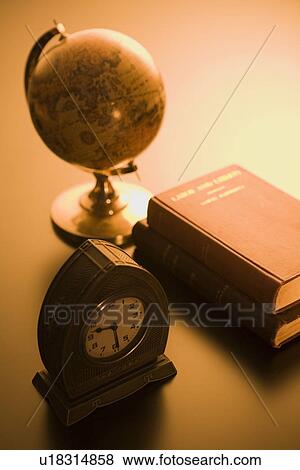 Globe, books and clock View Large Photo Image Stock Photo - Globe, books and clock. Fotosearch