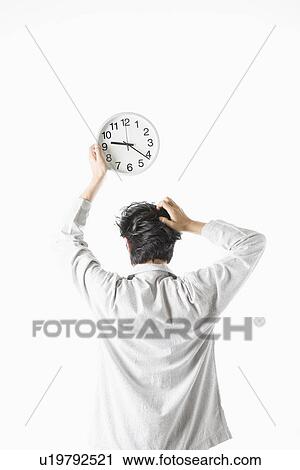 Stock Image - Man overslept in morning. Fotosearch