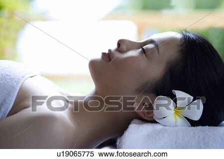 Stock Photography - Woman lying down and relaxing, Saipan. Fotosearch