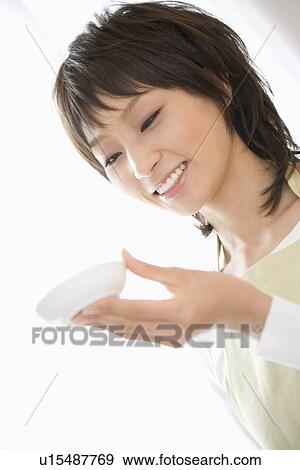 Housewife cooking in kitchen View Large Photo Image Stock Photo - Housewife cooking in kitchen. Fotosearch