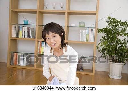 Picture - Housewife folding laundry. Fotosearch