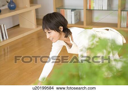 Picture - Housewife wiping floor. Fotosearch