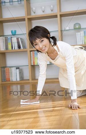 Housewife wiping floor View Large Photo Image Stock Image - Housewife wiping floor. Fotosearch