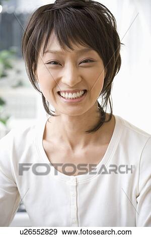 Portrait of smiling woman View Large Photo Image Stock Photo - Portrait of smiling woman. Fotosearch