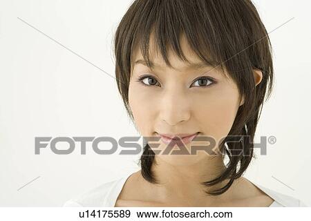 Portrait of young woman smiling View Large Photo Image Stock Photo - Portrait of young woman smiling. Fotosearch