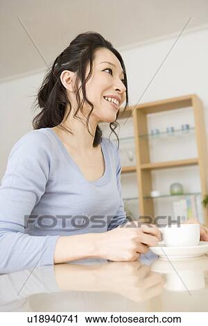 Young woman drinking coffee View Large Photo Image Stock Image - Young woman drinking coffee. Fotosearch
