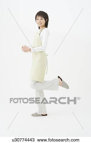 Young woman holding bowl View Large Photo Image Stock Image - Young woman holding bowl. Fotosearch