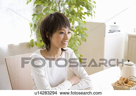 Young woman listening View Large Photo Image Picture - Young woman listening. Fotosearch