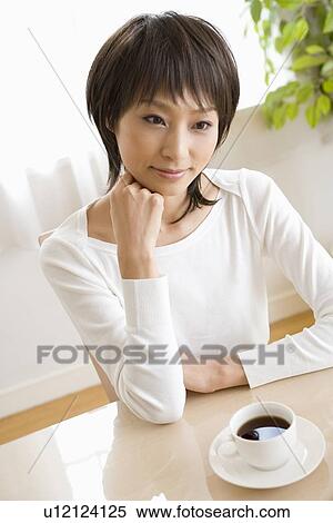 Stock Photography - Young woman listening. Fotosearch