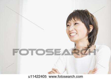 Young woman smiling View Large Photo Image Stock Photography - Young woman smiling. Fotosearch