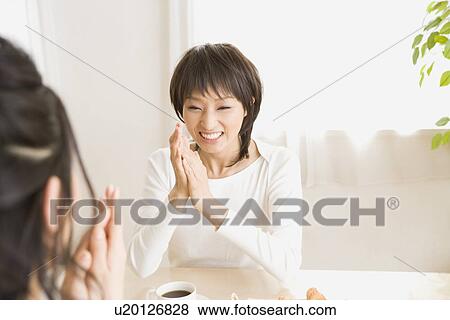 Young women talking View Large Photo Image Stock Photo - Young women talking. Fotosearch
