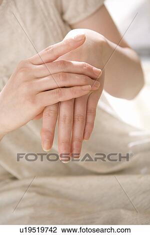 Young woman applying moisturizer View Large Photo Image Stock Image - Young woman applying moisturizer. Fotosearch