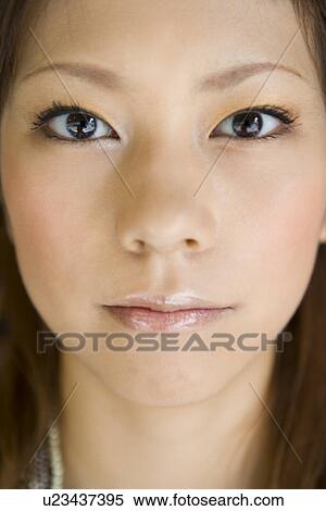 Young woman, close-up View Large Photo Image Stock Photography - Young woman, close-up. Fotosearch