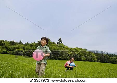 Children playing with balls View Large Photo Image Stock Image - Children playing with balls. Fotosearch