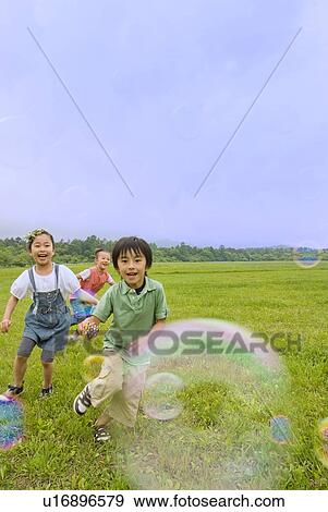 Children playing with bubble View Large Photo Image Stock Photo - Children playing with bubble. Fotosearch