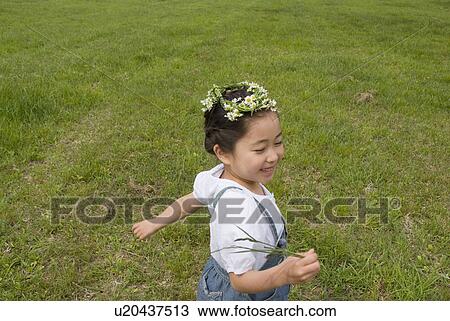 Stock Image - Girl with flower crown. Fotosearch