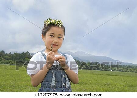 Stock Photography - Girl with flower crown. Fotosearch