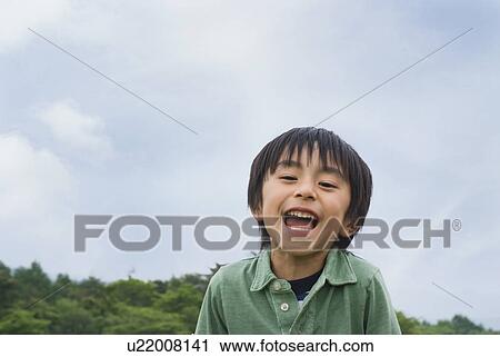 Stock Image - Portrait of smiling boy. Fotosearch