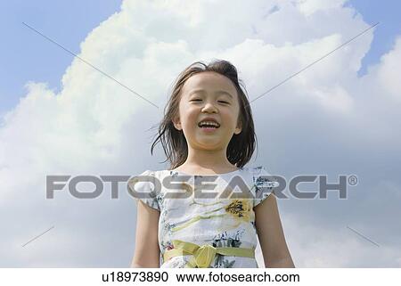 Stock Image - Portrait of smiling girl. Fotosearch