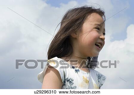 Stock Image - Portrait of smiling girl. Fotosearch