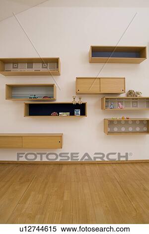 Shelves on wall View Large Photo Image Stock Photography - Shelves on wall. Fotosearch