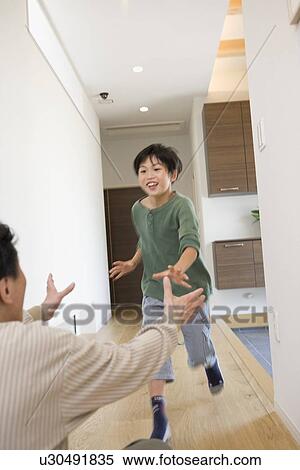 Boy running towards grandfather View Large Photo Image Stock Photography - Boy running towards grandfather. Fotosearch