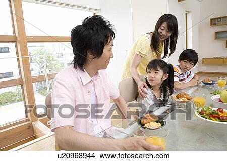 Family eating breakfast View Large Photo Image Picture - Family eating breakfast. Fotosearch