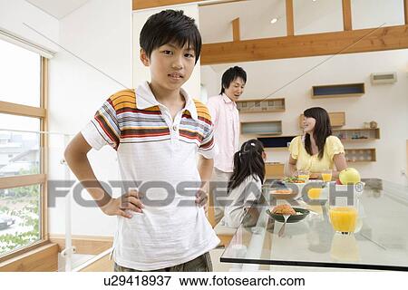 Family eating breakfast View Large Photo Image Stock Photo - Family eating breakfast. Fotosearch