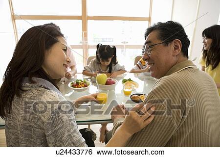 Family eating breakfast View Large Photo Image Stock Photograph - Family eating breakfast. Fotosearch
