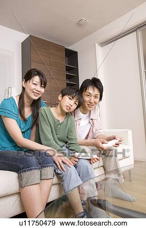 Family playing with video game View Large Photo Image Stock Photo - Family playing with video game. Fotosearch