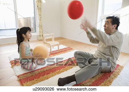 Grandfather and girl playing View Large Photo Image Stock Photograph - Grandfather and girl playing. Fotosearch