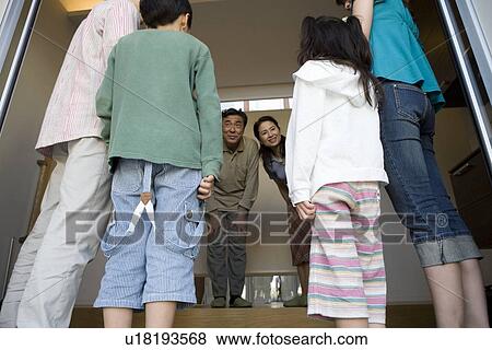 Stock Photo - Grandparents welcoming grandchildren. Fotosearch