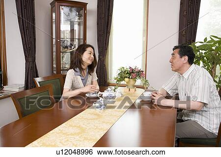 Mature couple drinking tea View Large Photo Image Stock Photograph - Mature couple drinking tea. Fotosearch