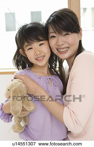Stock Photo - Portrait of mother and daughter. Fotosearch