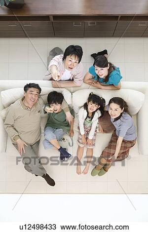 Stock Image - Portrait of three generation family. Fotosearch