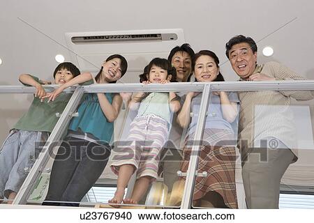 Stock Image - Portrait of three generation family. Fotosearch