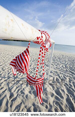 Stock Photography - Bikini hanging on pole. Fotosearch