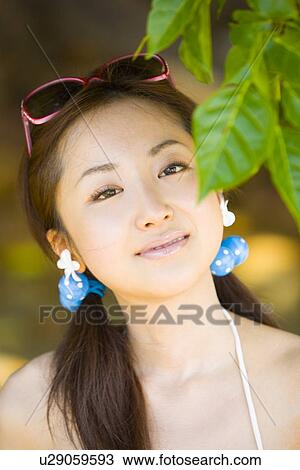 Stock Image - Portrait of young woman in bikini. Fotosearch