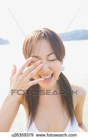 Stock Photo - Portrait of young woman in bikini. Fotosearch