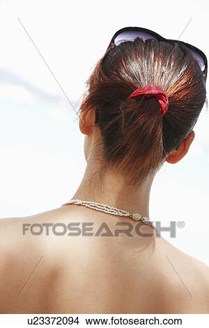 Picture - Rear view of young woman. Fotosearch