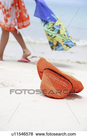 Stock Photo - Straw Hat at beach. Fotosearch