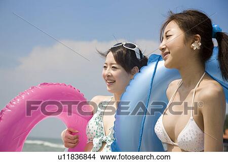 Picture - Two young women in bikini. Fotosearch