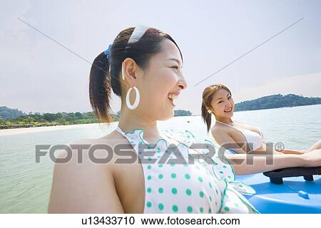 Stock Image - Two young women in bikini. Fotosearch