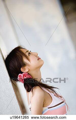 Young woman looking up View Large Photo Image Stock Photography - Young woman looking up. Fotosearch